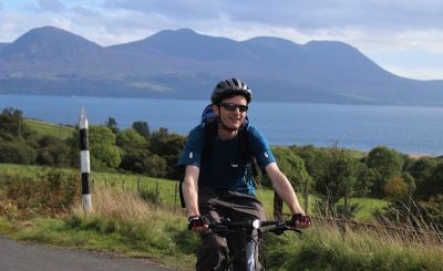 Andrew Richards Cycling on the  tour with redspokes